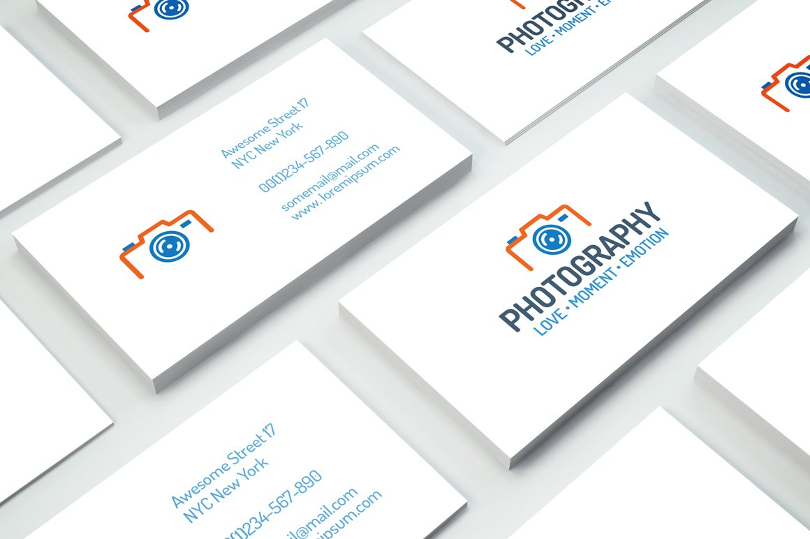White business cards with the minimalistic camera logo.