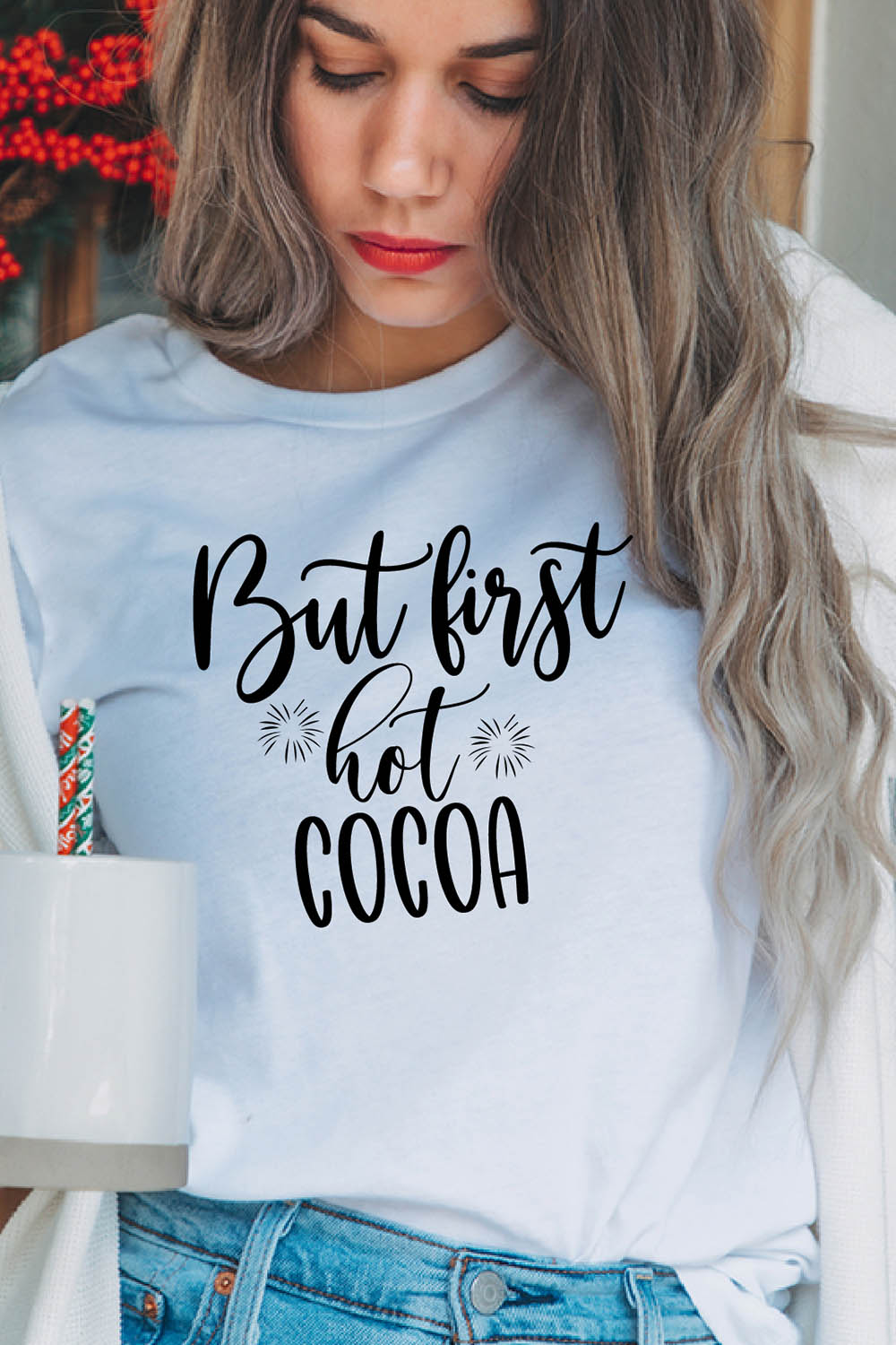 Image of a girl in a white T-shirt with a wonderful black inscription "but first hot cocoa".