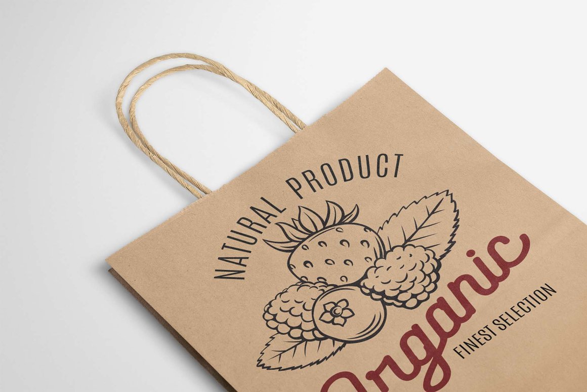A craft packaging with black vintage illustration of berries and red lettering "Organic" on a gray background.