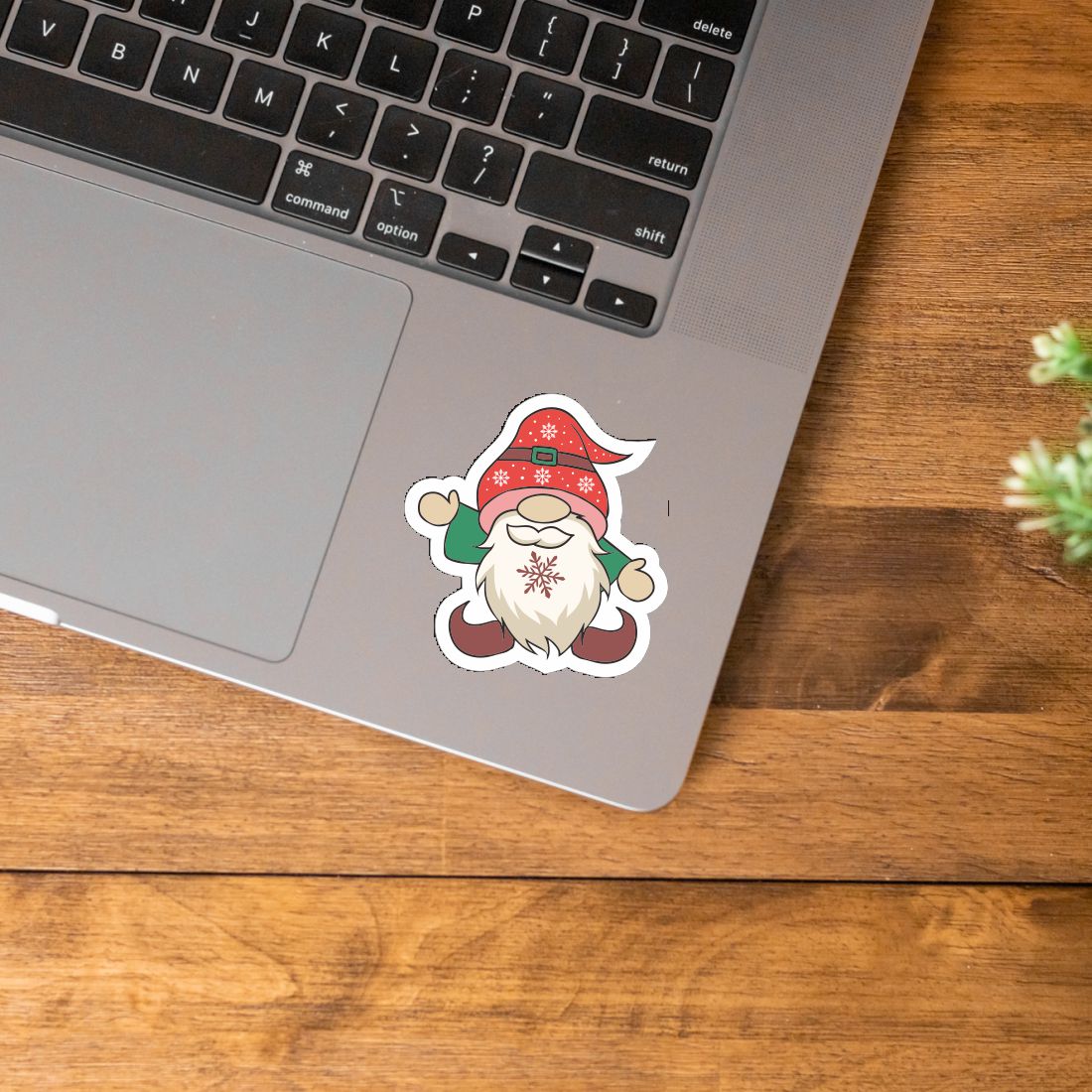 Image of laptop with santa gnome sticker.