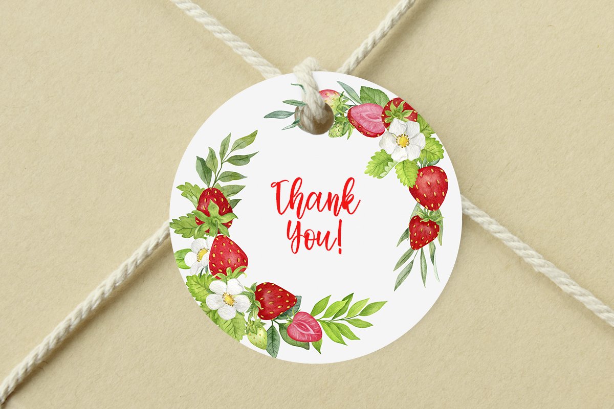 White round label with red lettering "Thank you!" and illustrations of strawberries.