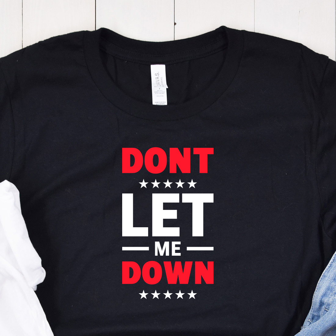 Image of a black t-shirt with the enchanting inscription "dont let me down" in red and white colors.