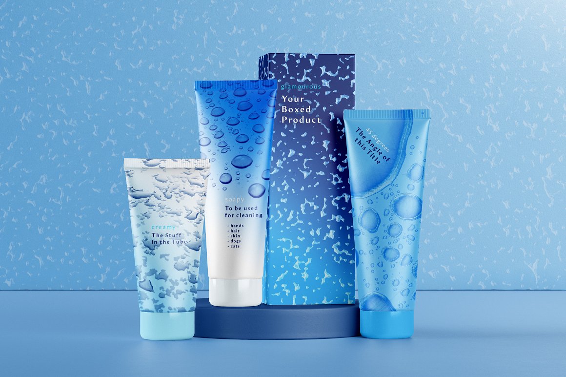 3 blue skincare products and box with water drop brushes on a blue background.