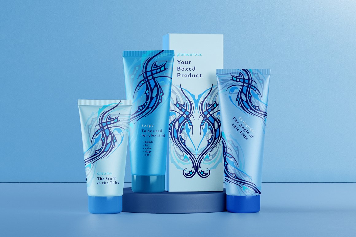 3 blue skincare products and box with tattoo designs on a blue background.