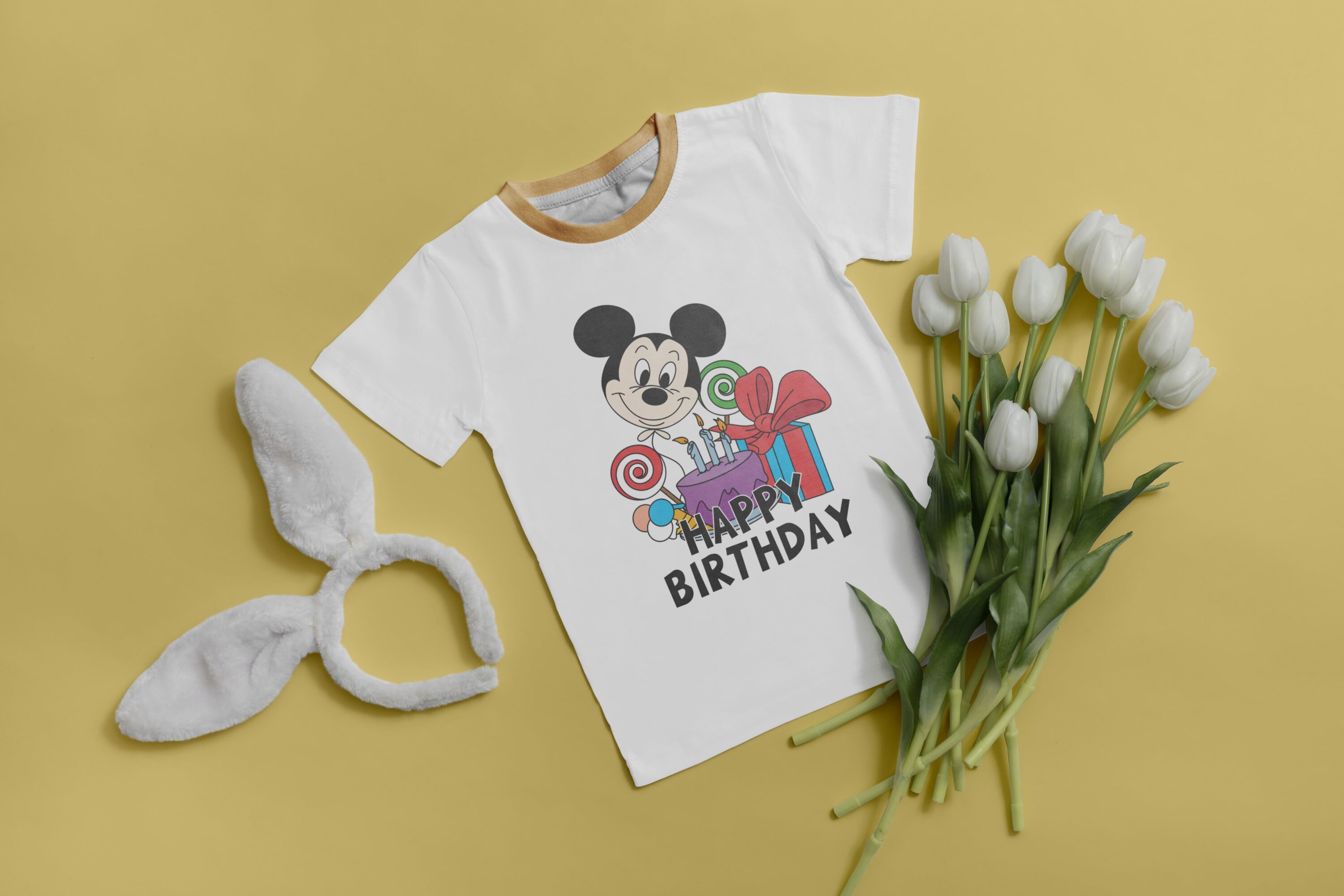 Lots of birthday gifts for Mickey Mouse on the white t-shirt.
