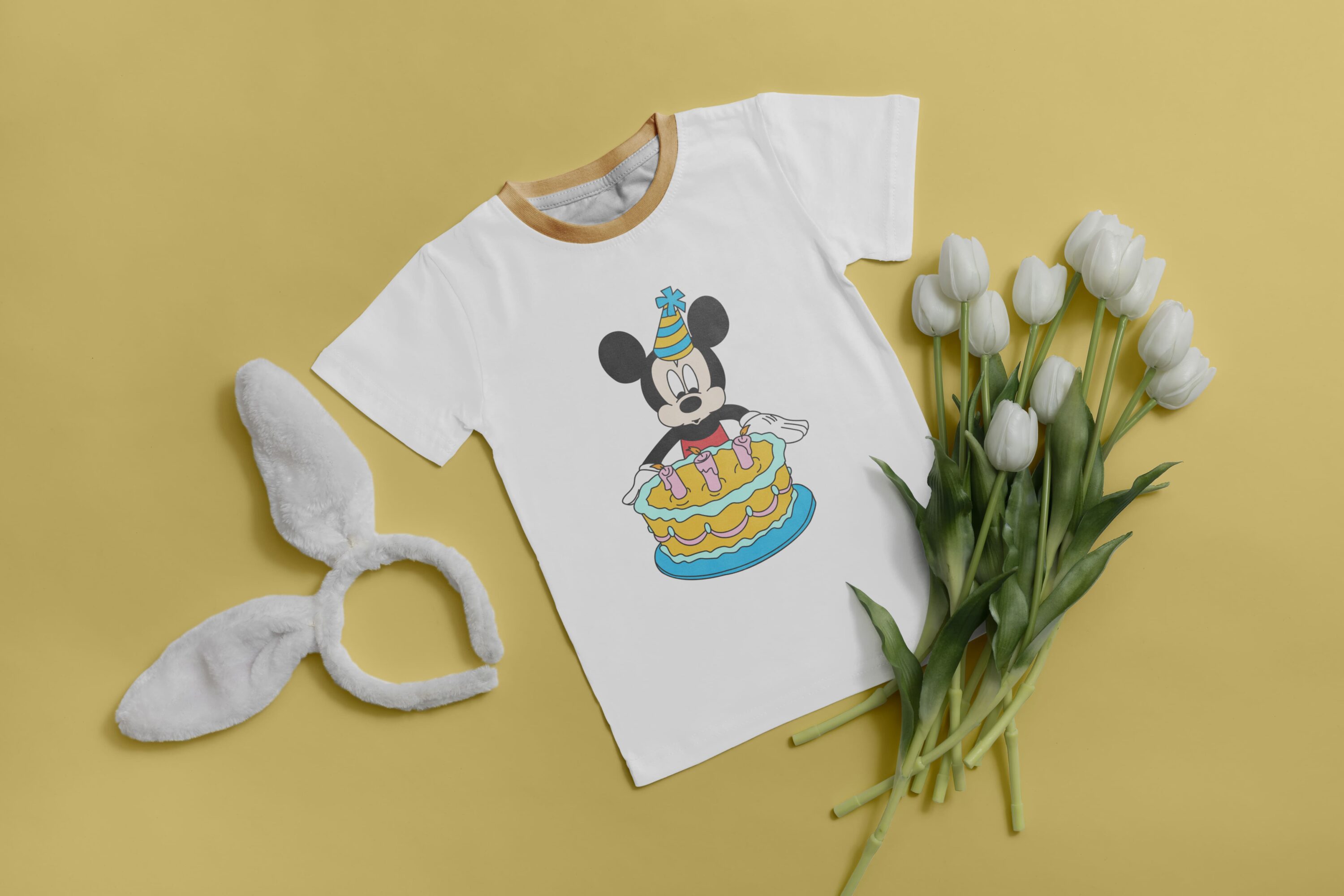 A little Mickey Mouse is ready to celebrate his birthday.