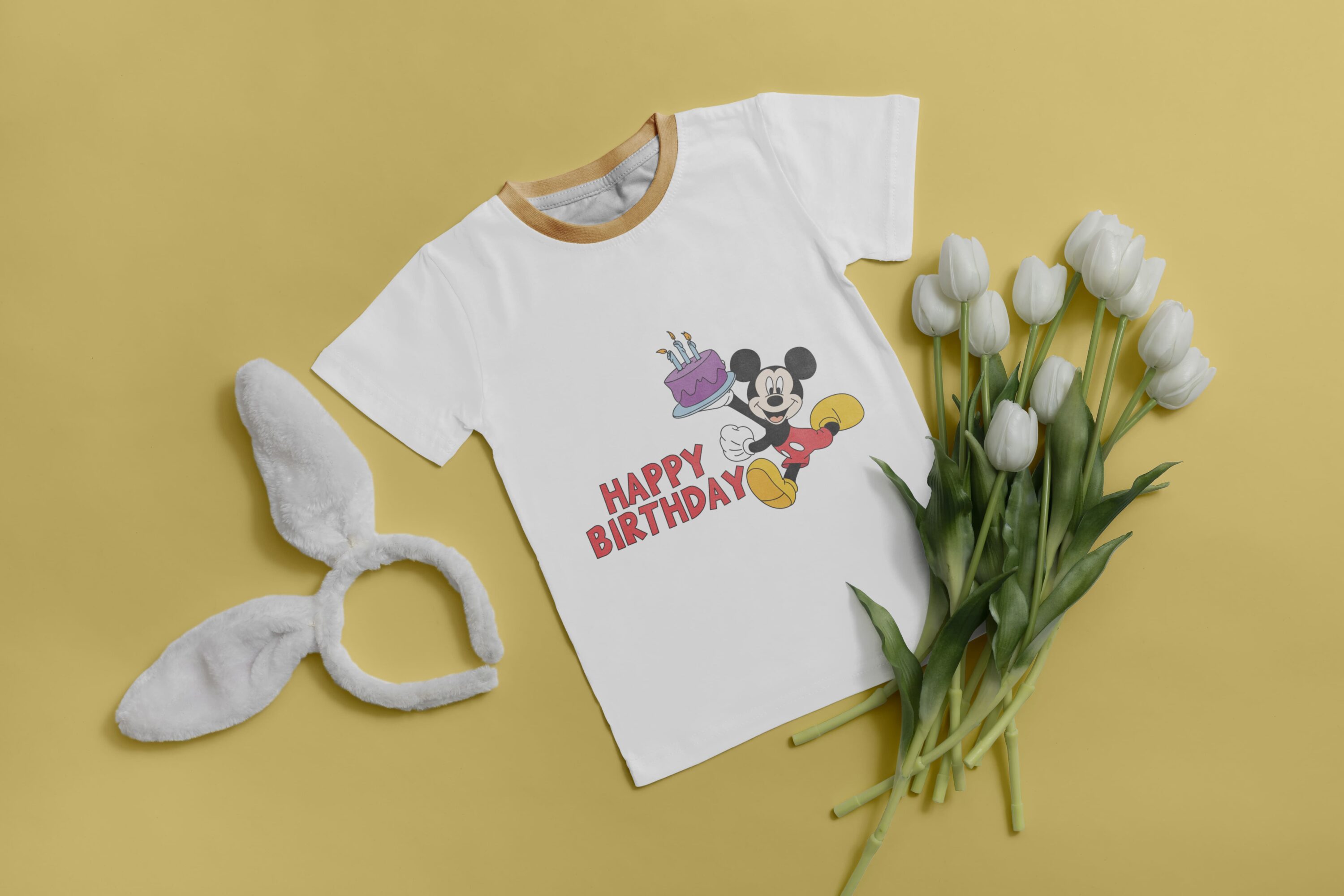 Kid's white t-shirt with the Happy birthday lettering with the festive Mickey Mouse.