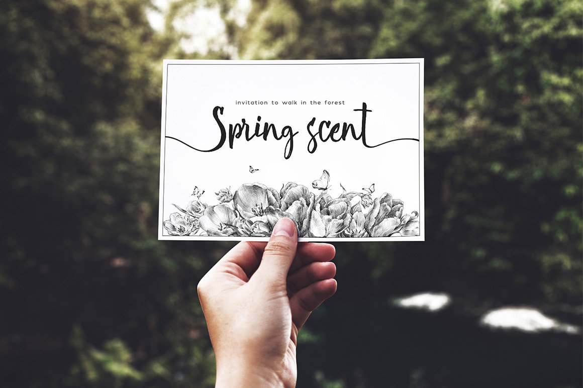 White greeting card with black lettering "Spring scent" and black illustrations of tulips and butterflies.