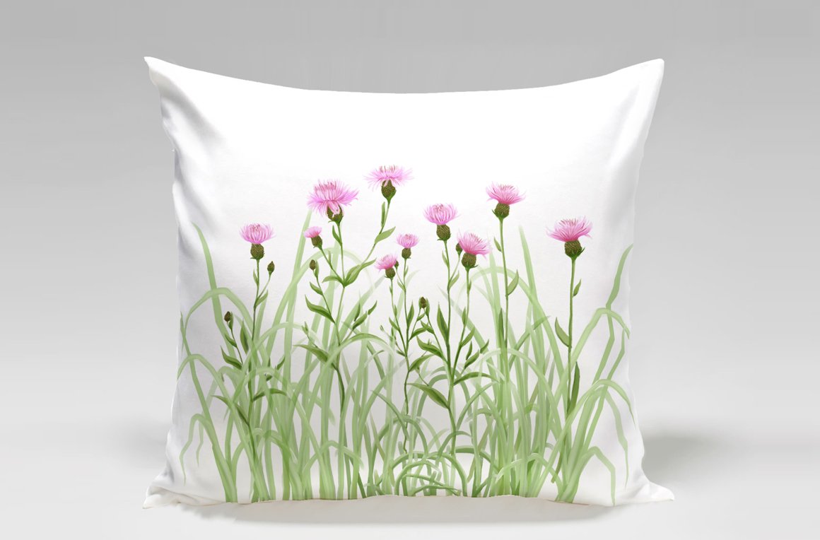 White pillow with delicate wild flowers graphic.