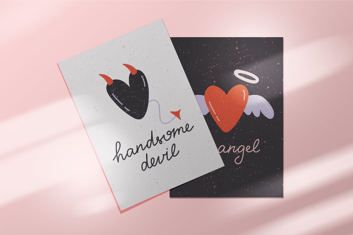 Black card and white card with letterings and angel and devil hearts.