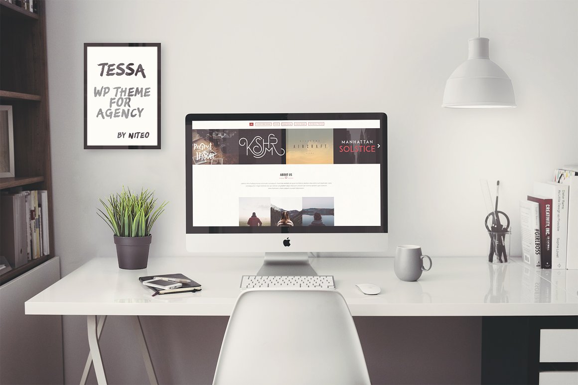 Mockup of iMac with Tessa website on the table.