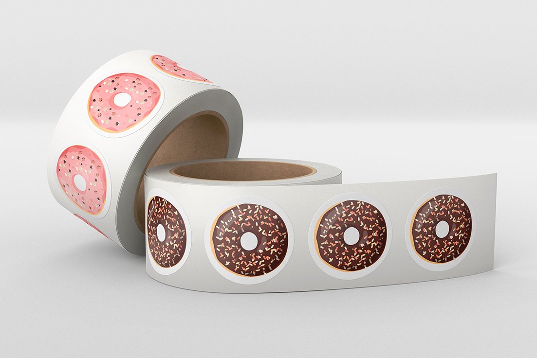2 tapes with stickers of illustrations of pink and brown donuts on a gray background.