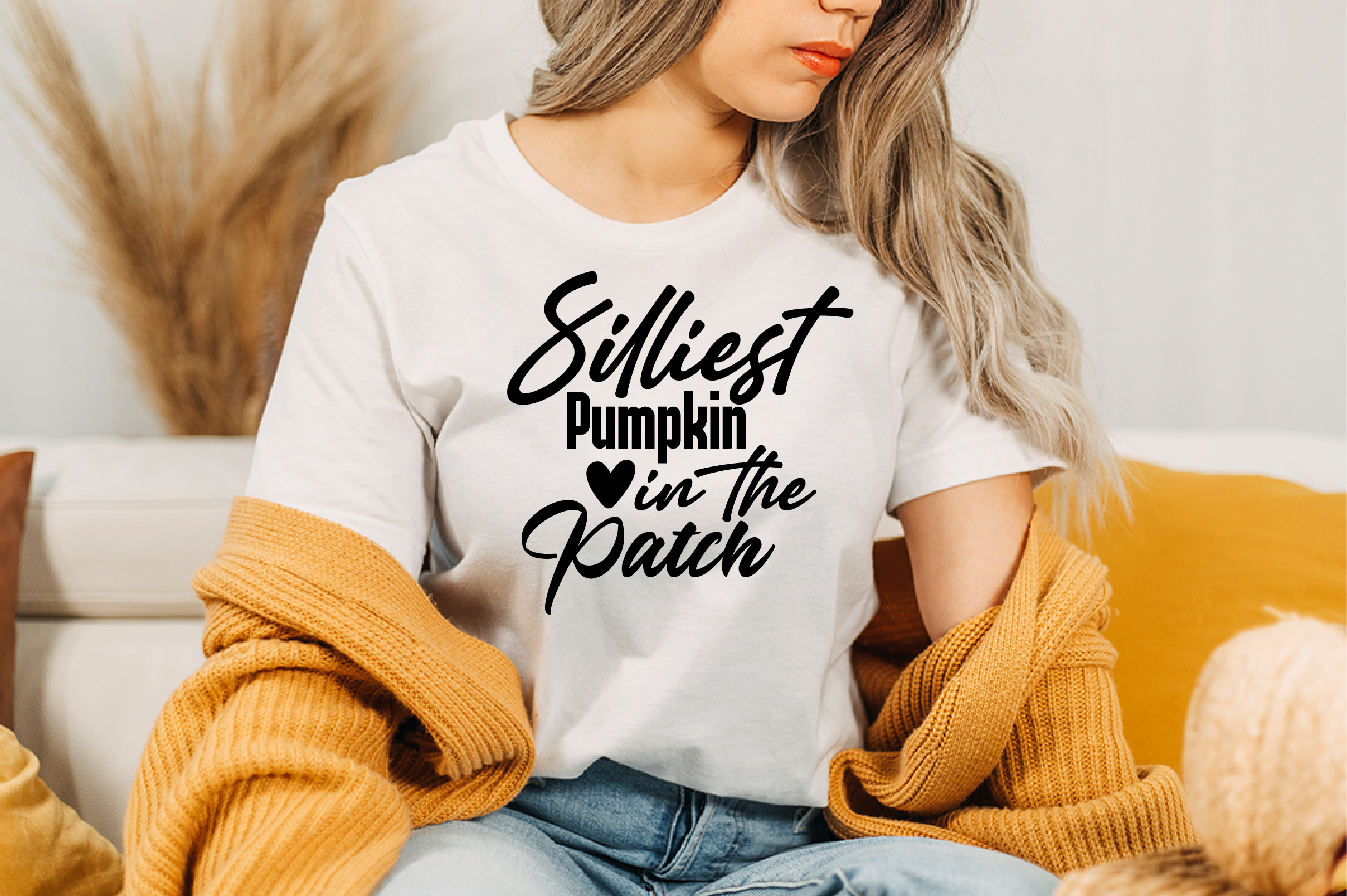 Image of a white T-shirt with a wonderful black slogan Silliest Pumpkin In The Patch.