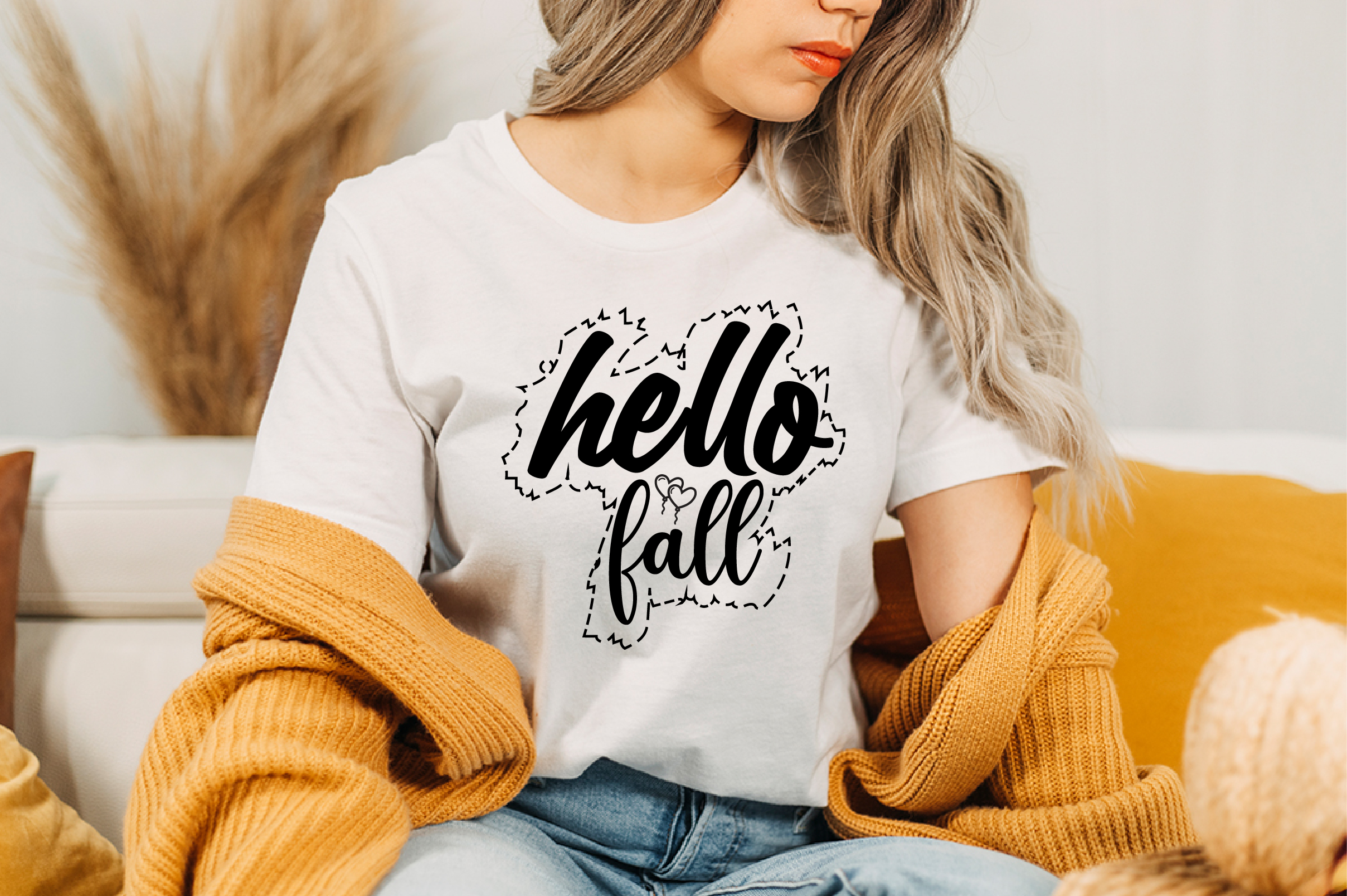 Image of a white t-shirt with a unique black inscription hello fall.