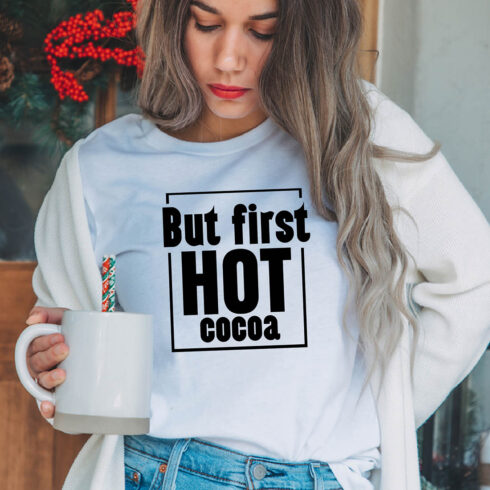 Image of a girl in a white t-shirt with an irresistible slogan "But first hot cocoa".