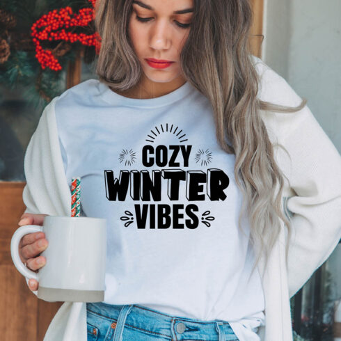 Image of a girl in a white t-shirt with a great inscription "cozy winter vibes".