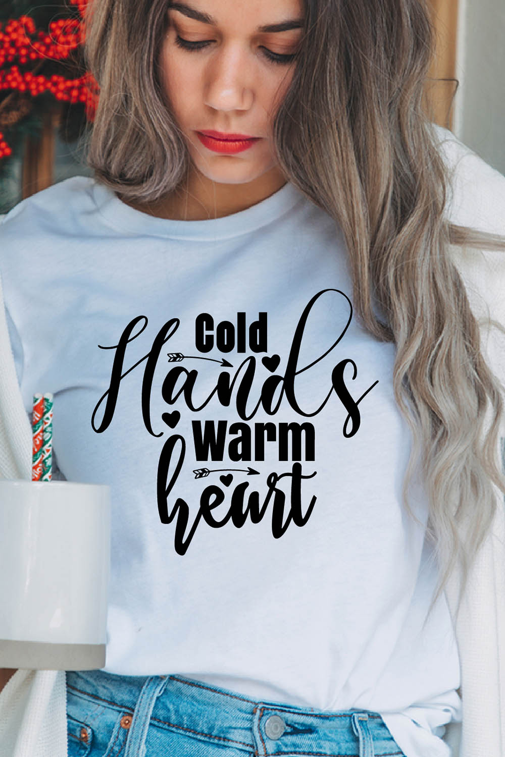 mage of a girl in a white t-shirt with an exquisite inscription "Cold hands, warm heart".