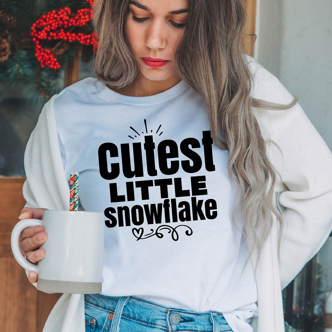 Image of a girl in a white T-shirt with a charming inscription "cutest little snowflake".