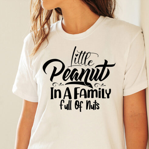 Picture of a white T-shirt with irresistible black slogan Little Peanut In A Family Full Of Nuts.