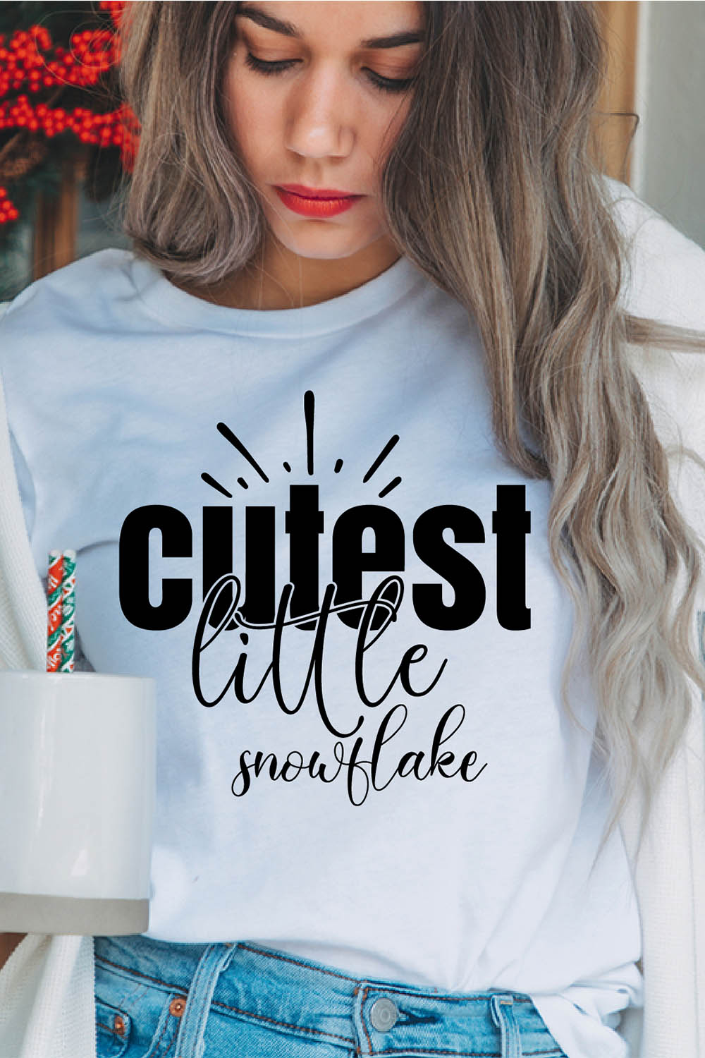 Image of a girl in a white t-shirt with a beautiful inscription "Cutest little snowflake".