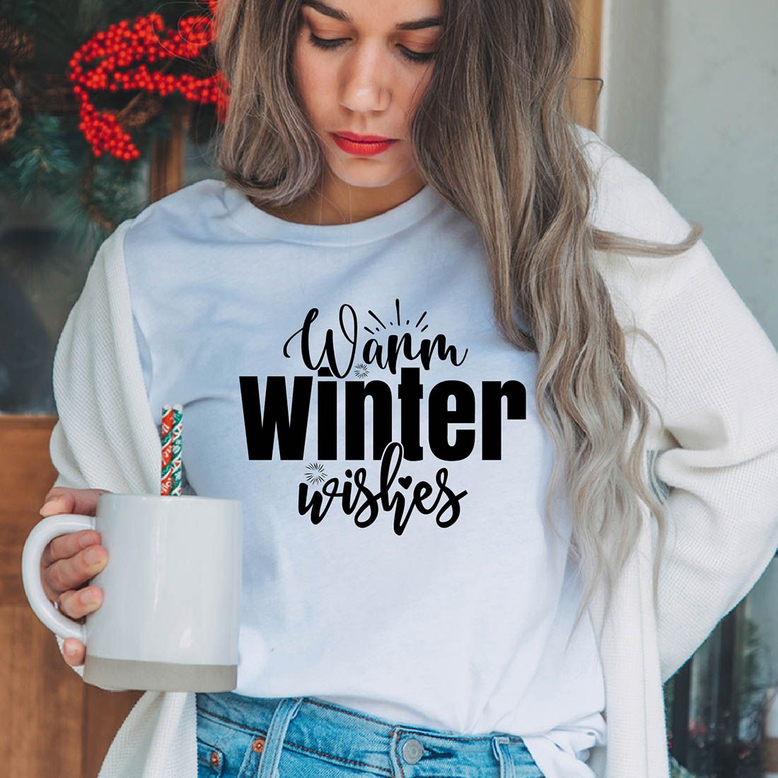 Image of a girl in a white T-shirt with an exquisite inscription "Warm Winter Wishes".