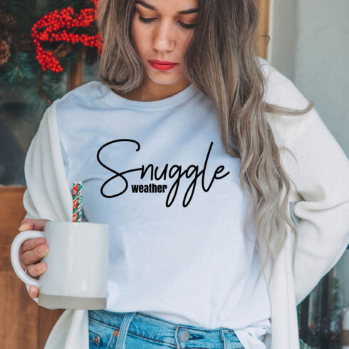 Image of a girl in a white t-shirt with a unique inscription "Snuggle weather".