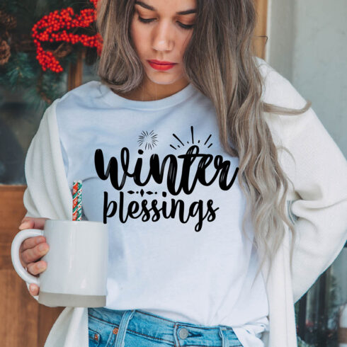 Image of a girl in a white t-shirt with a great inscription "winter blessings".