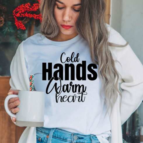 Image of a girl in a white T-shirt with a wonderful black inscription "Cold Hands Warm Heart".