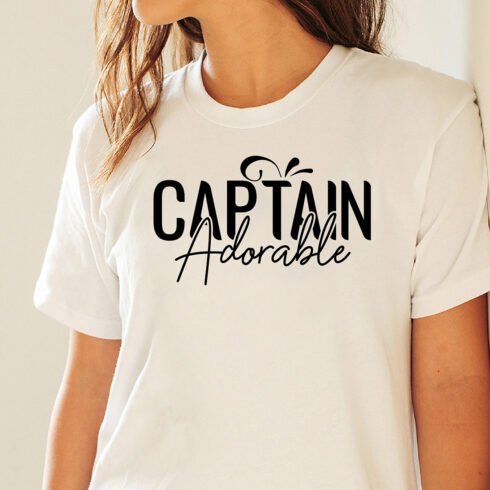 Image of a white t-shirt with a charming black Captain Adorable lettering.