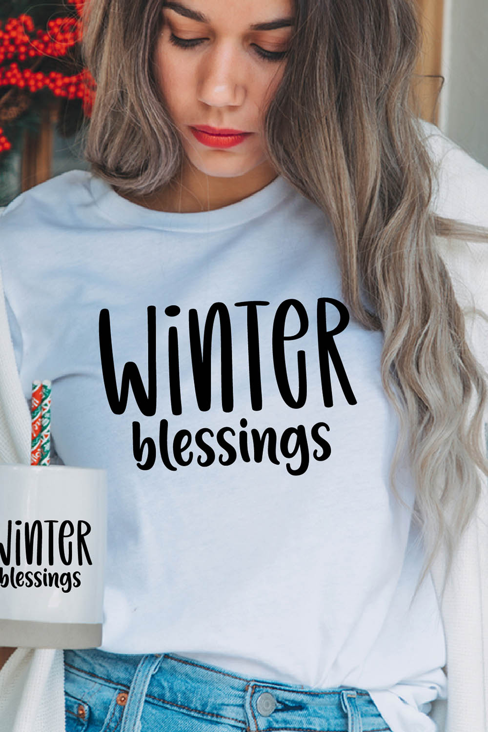 Image of a girl in a white t-shirt with a charming inscription "winter blessings".