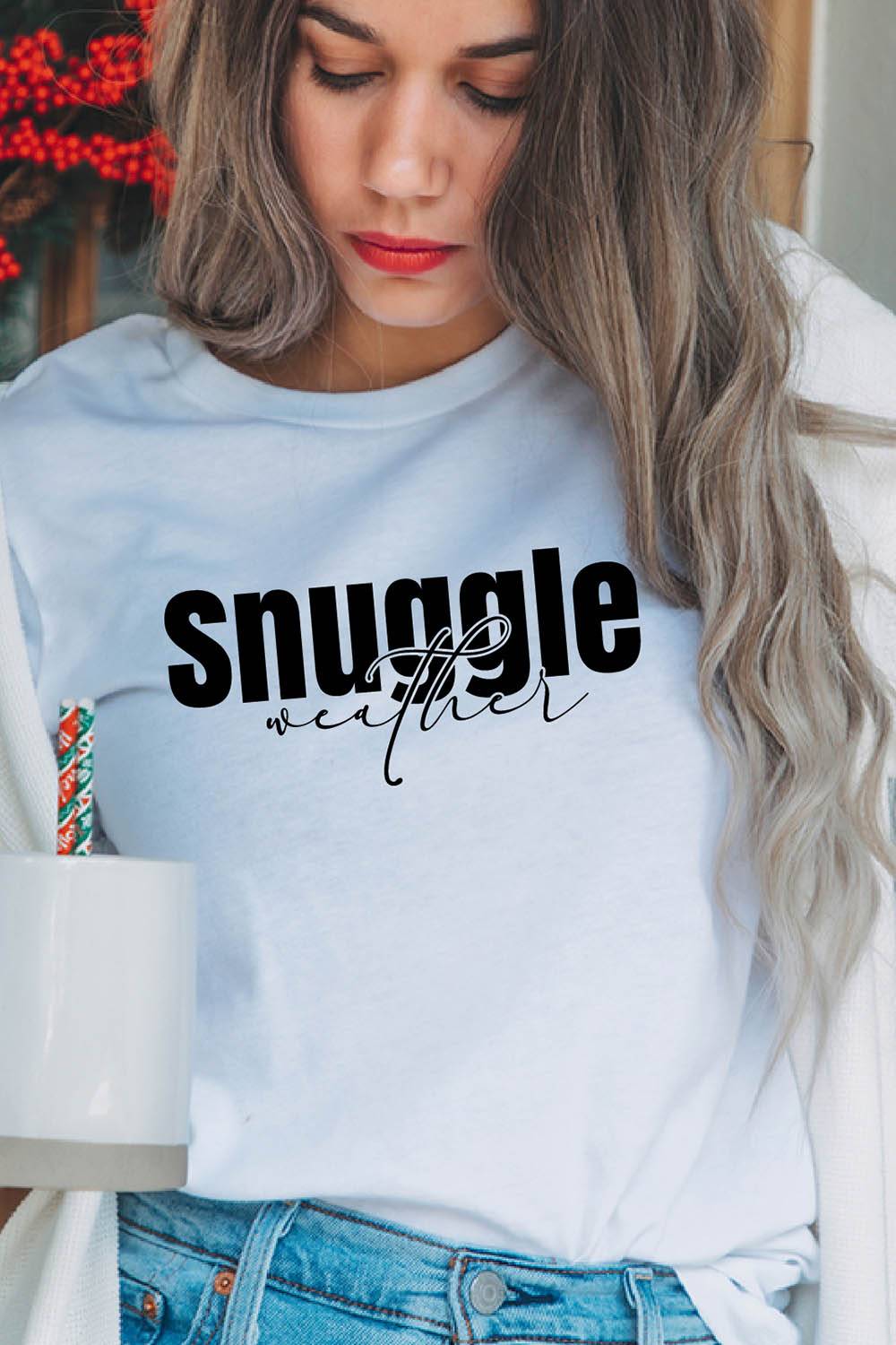 Image of a girl in a white t-shirt with a unique slogan "Snuggle weather".