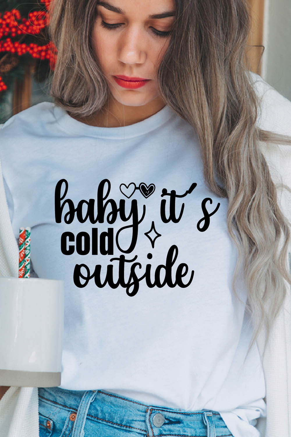 Image of a girl in a white T-shirt with a charming inscription "Baby, it's cold outside".