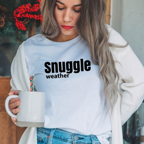 Image of a girl in a white t-shirt with a unique slogan "Snuggle weather".