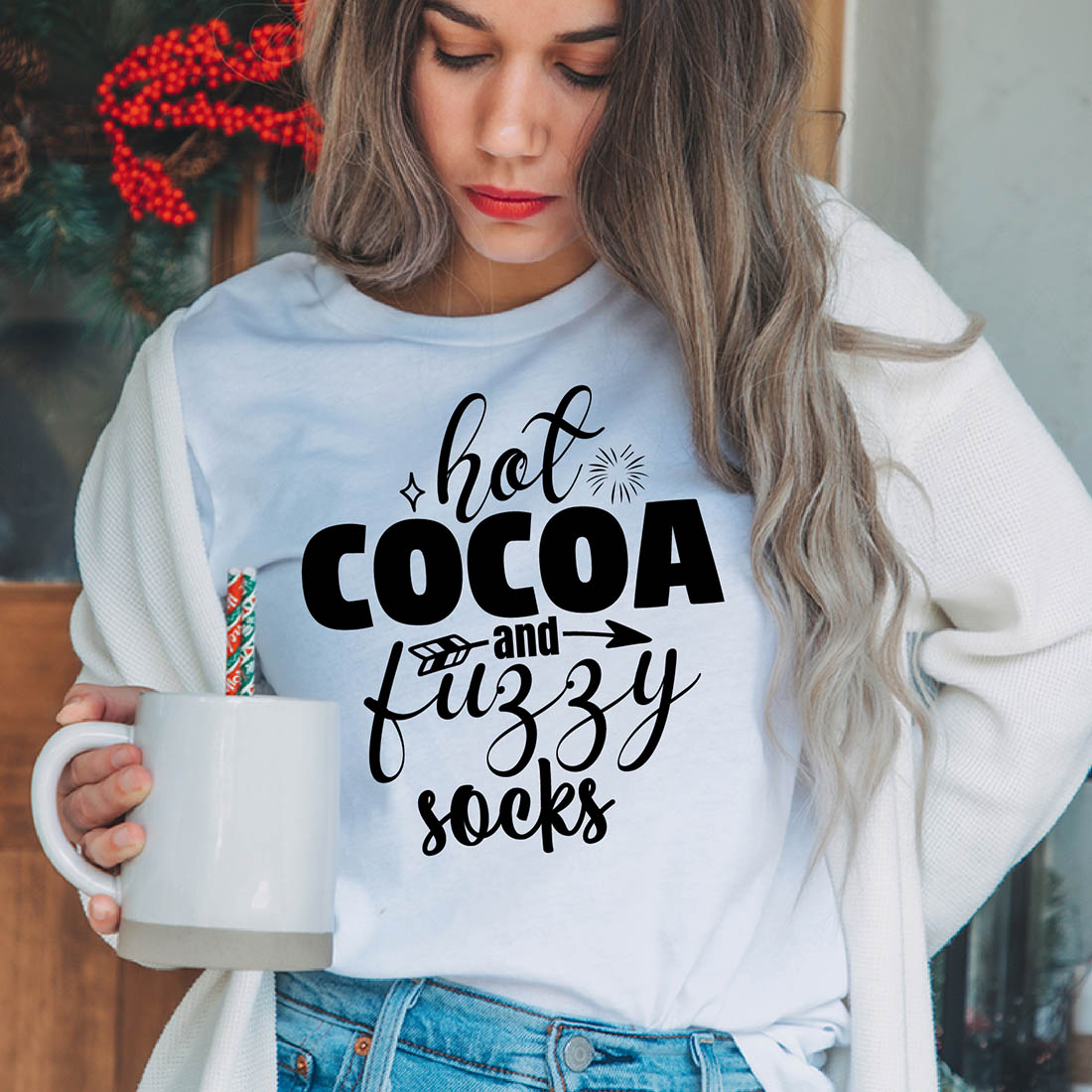 Image of a girl in a white t-shirt with a beautiful inscription "hot cocoa and fluffy socks"