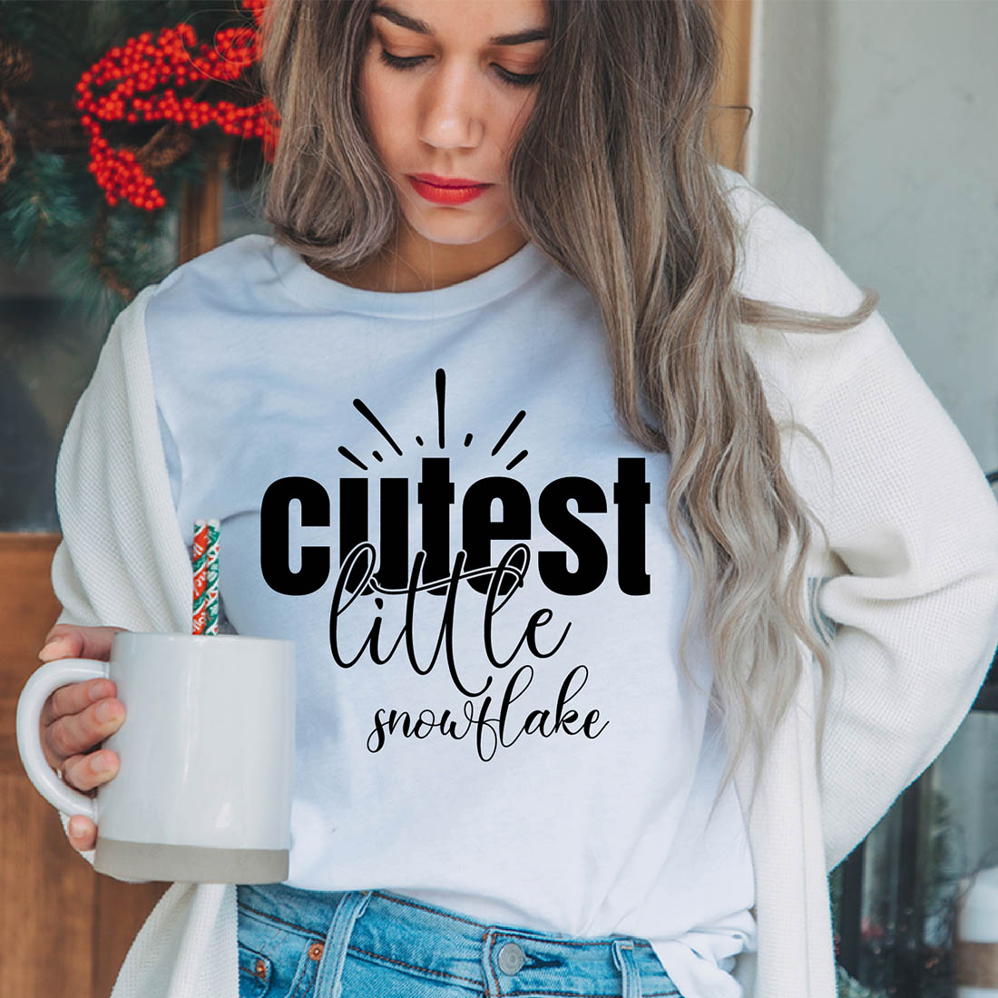 Image of a girl in a white t-shirt with a charming inscription "Cutest little snowflake".