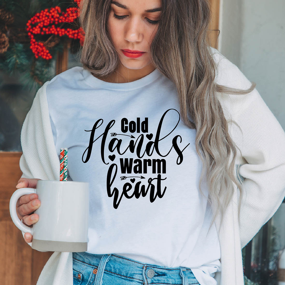 Image of a girl in a white T-shirt with an elegant inscription "Cold hands, warm heart".