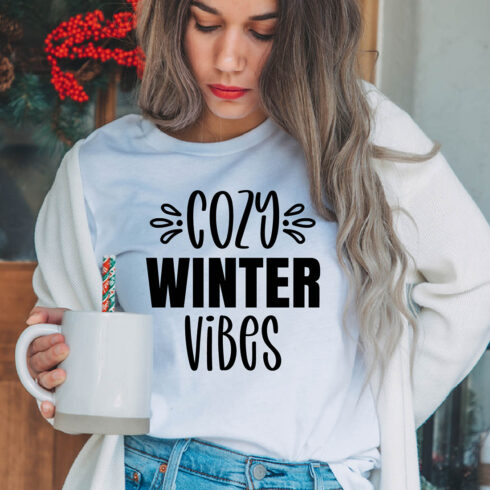 Image of a girl in a white t-shirt with a gorgeous inscription "cozy winter vibes".