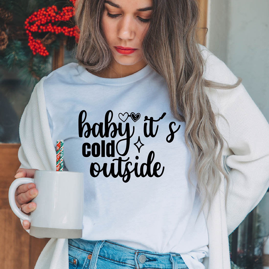 Image of a girl in a white t-shirt with a gorgeous inscription "Baby, it's cold outside".