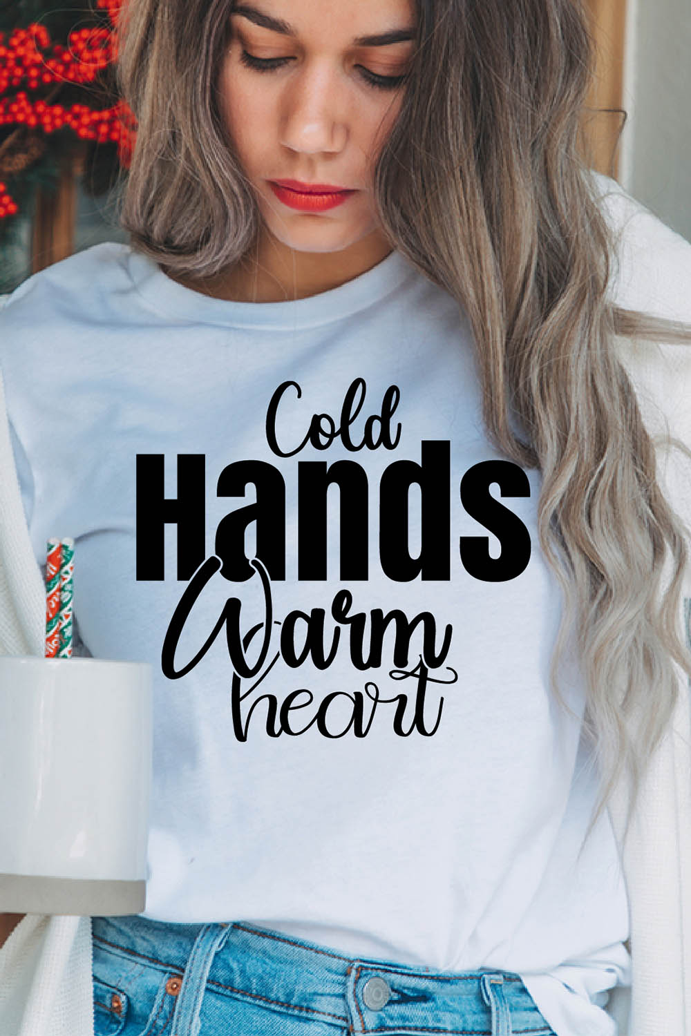 Image of a girl in a white T-shirt with an irresistible black inscription "Cold Hands Warm Heart".