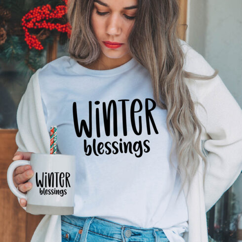 Image of a girl in a white t-shirt with a gorgeous "winter blessings" lettering.