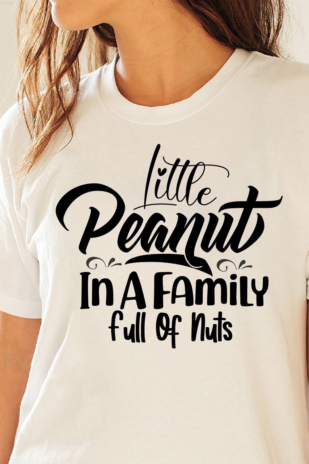 Image of a white t-shirt with enchanting black lettering Little Peanut In A Family Full Of Nuts.