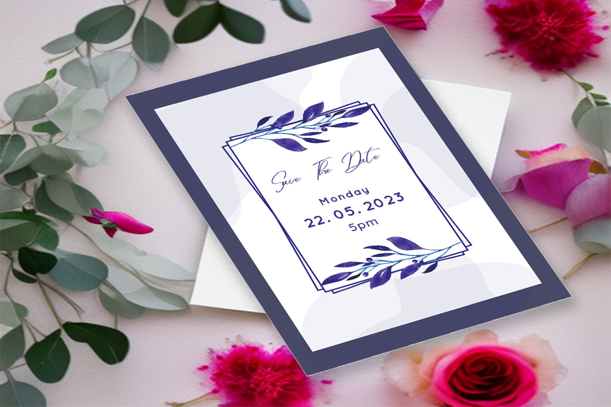 Image with elegant wedding invitation in blue tones and leaves.