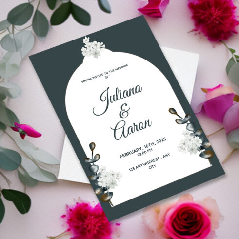 Image with gorgeous wedding invitation card in dark green and flowers.