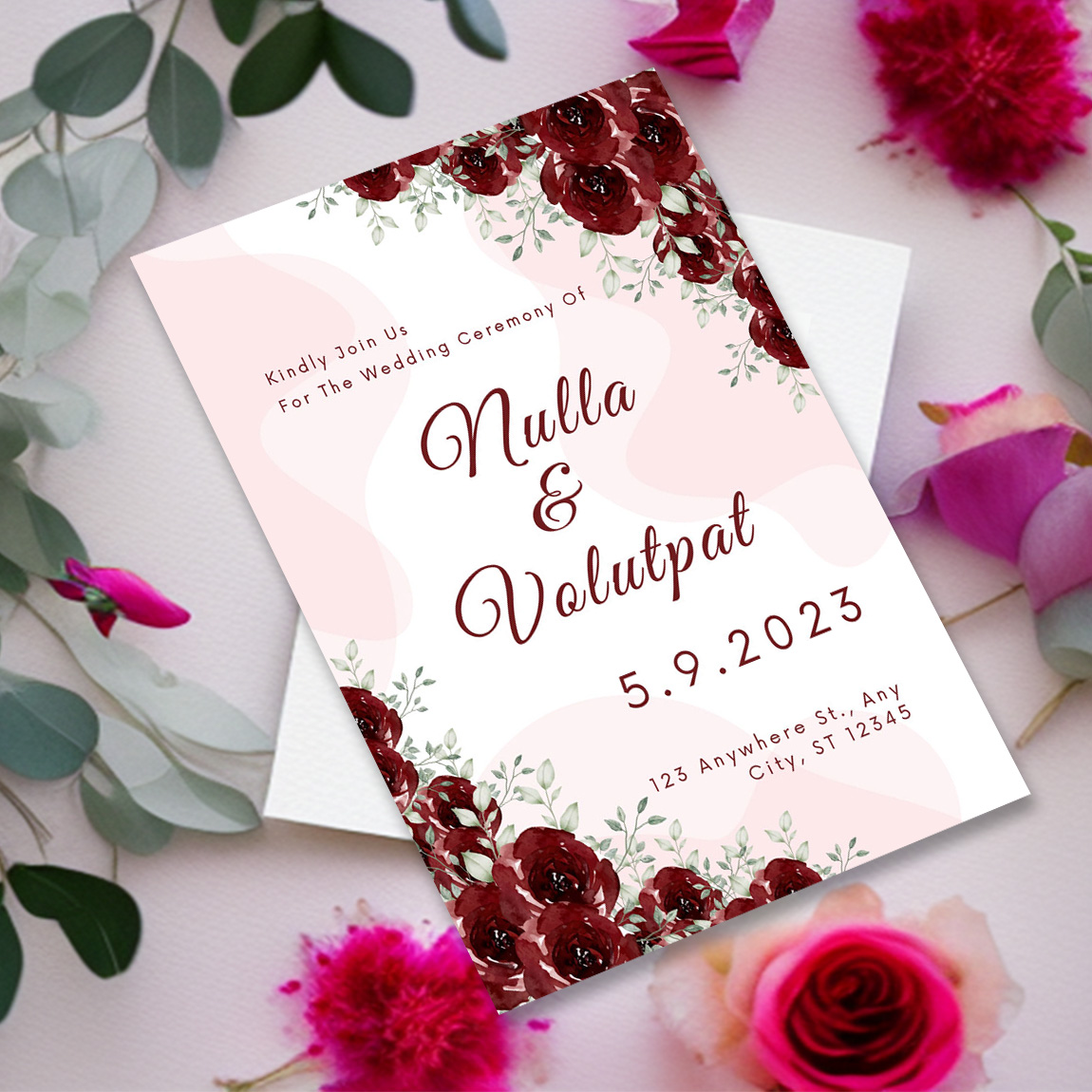 Image of charming wedding invitation card in pink colors and flowers.