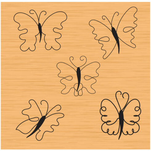 Wooden cutting board with different designs of butterflies.