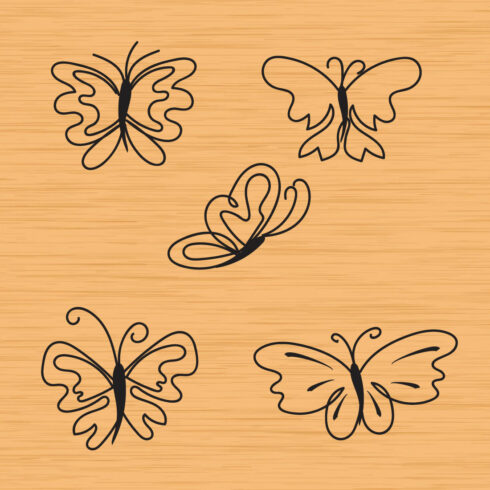 Set of four butterflies on a wooden background.