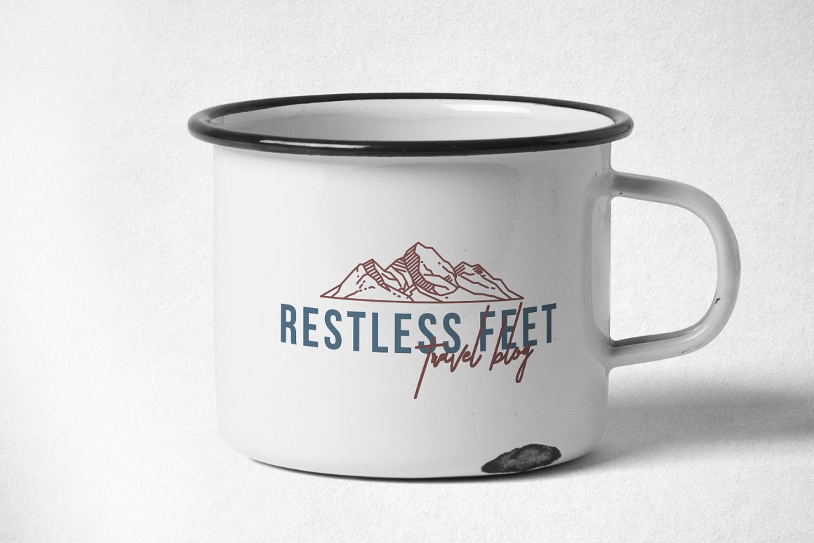 White cup with dirty blue lettering and dirty red mountain icon.