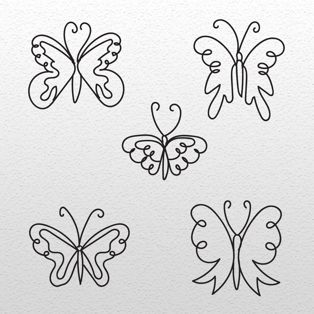 Set of four butterflies drawn on a piece of paper.