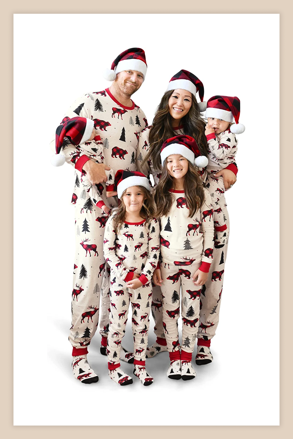 Family in Matching Christmas Holiday Pajamas.