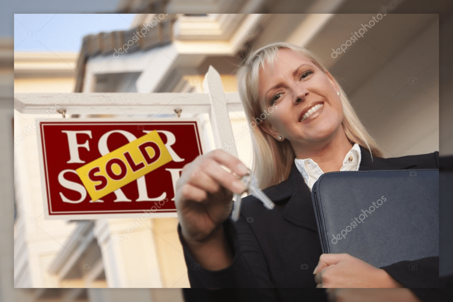 27 real estate agent with keys in front of sold sign 757